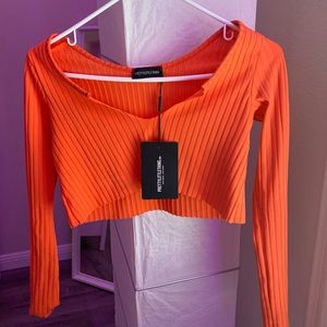 Orange long sleeve cropped shirt